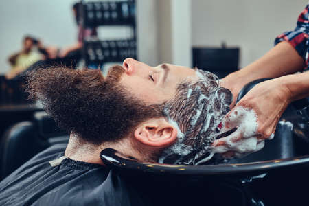 Handsome bearded man in the barbershop.の写真素材