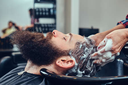 Handsome bearded man in the barbershop.の写真素材