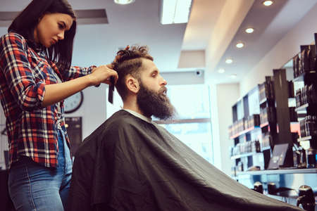Handsome bearded man in the barbershop.の写真素材