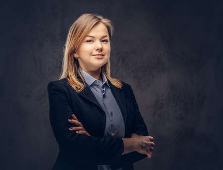 Studio portrait of a blonde businesswoman in a formal suit. Isolの写真素材