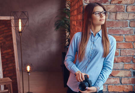 Portrait of a charming brunette in a studio.