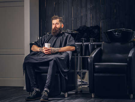 Handsome bearded man in the barbershop.の写真素材