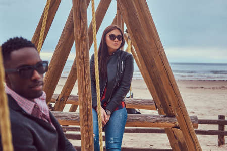 Attractive couple on the beach. African-American guy and Caucasiの写真素材