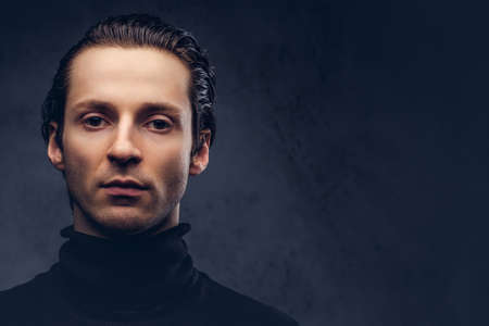 Portrait of a charismatic sensual male in black sweater with wetの写真素材