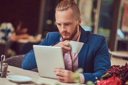 A handsome redhead businessman with a stylish haircut and beardの写真素材