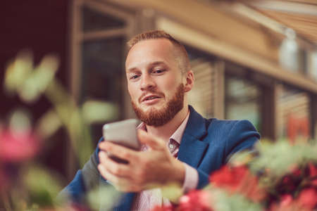 A handsome redhead businessman with a stylish haircut and beardの写真素材