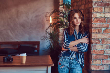 A young charming sensual girl listening to a music in headphonesの写真素材