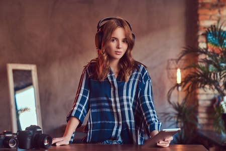 A young charming sensual girl listening to a music in headphonesの写真素材