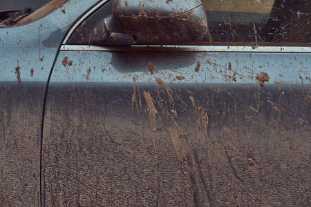 Close-up image of a dirty car after a trip around the countrysideの写真素材