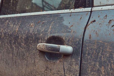 Close-up image of a dirty car after a trip around the countrysideの写真素材