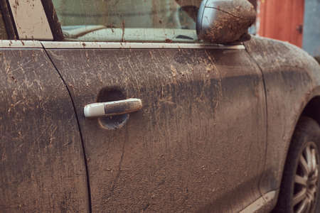 Close-up image of a dirty car after a trip around the countrysideの写真素材