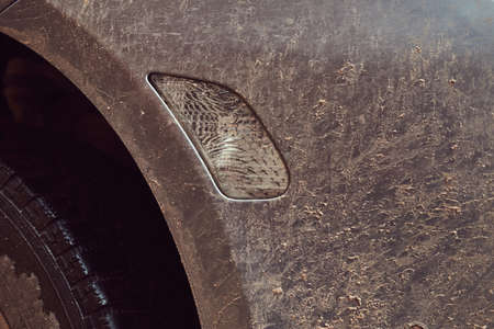 Close-up image of a dirty car after a trip around the countrysideの写真素材