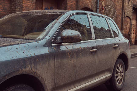 Close-up image of a dirty car after a trip around the countrysideの写真素材