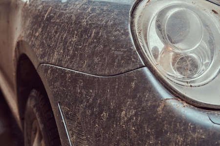 Close-up image of a dirty car after a trip around the countrysideの写真素材