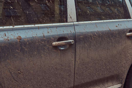 Close-up image of a dirty car after a trip around the countrysideの写真素材