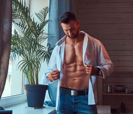 Portrait of a tall bearded male with a muscular body.の写真素材