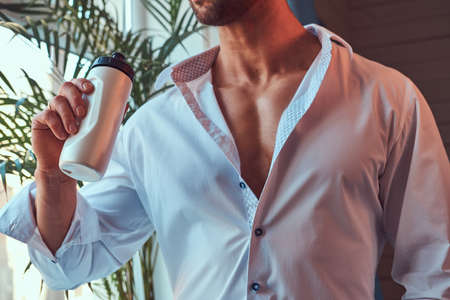 Portrait of a tall bearded male with a muscular body.の写真素材