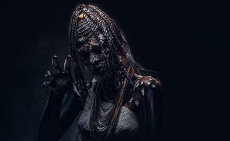 Close-up portrait of a witch from the indigenous African tribe, wearing traditional costume. Make-up concept.の写真素材
