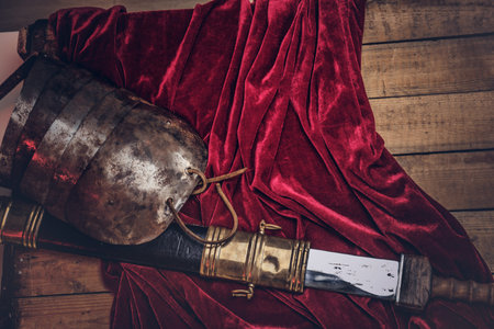 Complete combat equipment of the ancient Greek warrior on a wooden boards.