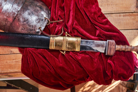 Complete combat equipment of the ancient Greek warrior on a wooden boards.