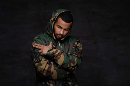 Handsome African-American guy wear military jacket.の写真素材