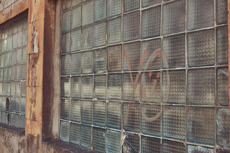 Industrial background, European grunge urban street with warehouse brick wall.の写真素材