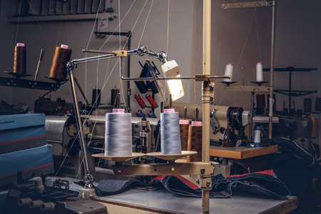 Picture of a tailor's desktop at a sewing workshop.の写真素材