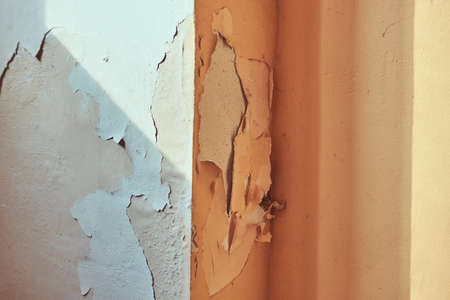Image of destructive plaster on the wall of the building.の写真素材