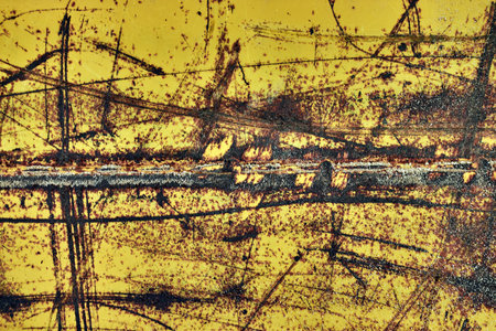 Image of an old worn metal surface with a scratched color.