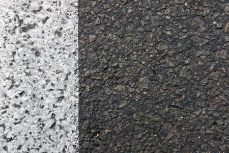 Image of a new road surface made of asphalt with a painted white line.の写真素材