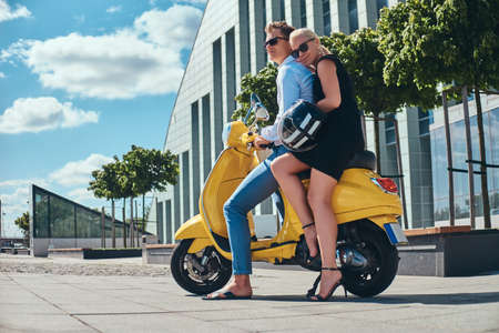 Summer Europe vacation, date, romance. Happy attractive couple - charming blonde woman wearing black...