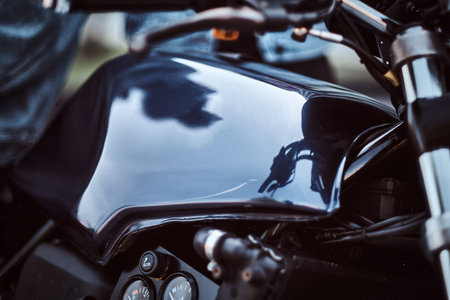 Close-up photo of a custom-made retro motorcycle fuel tank with sensors.