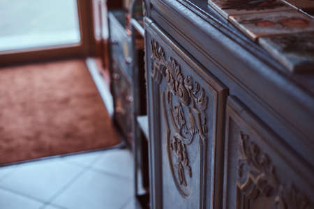 Old, antique, vintage. Close-up photo of hand-painted tiles on a vintage bookshelf.の写真素材