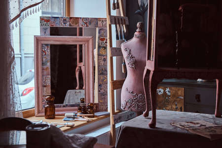 Sculpture bust and tools, mirror, frame in the creative workshop.の写真素材