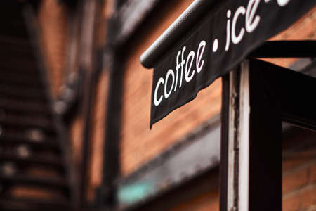 Close-up of a brick restaurant exterior. Cafe, restaurant, shop concept.の写真素材