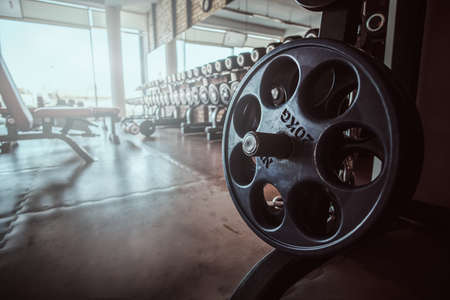 Photo of sport equipment in trendy sunny gym.の写真素材