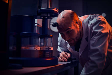 Expirienced watchmaker is working with autoclave at his own studio.