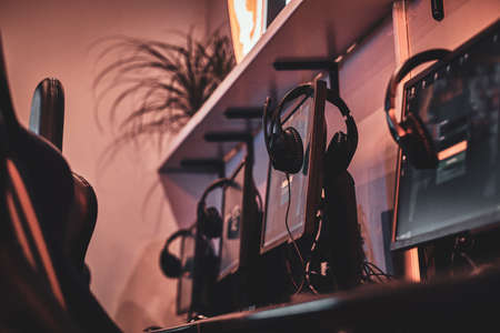 Empty comfortable studio for professional gamers with computers and earphones.の写真素材