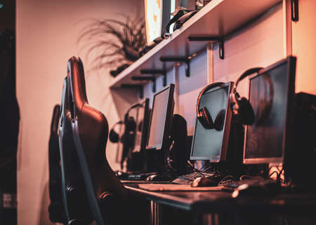 Empty comfortable studio for professional gamers with computers and earphones.の写真素材