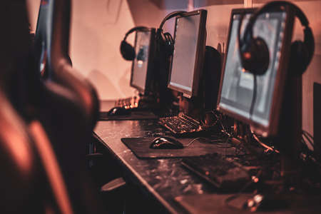 Empty comfortable studio for professional gamers with computers and earphones.の写真素材