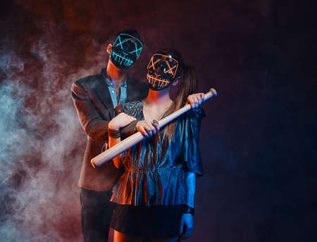 Couple wearing masks close up.