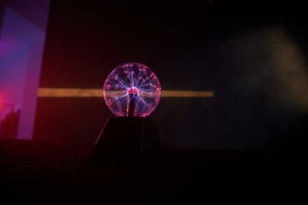 Plasma lamp in the dark room is making interesting light effects.の写真素材