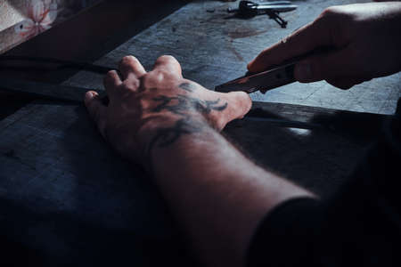Closeup photo shoot of talented leather designer at his workshop.