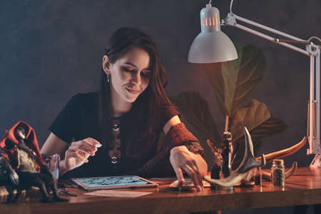 Beautiful young gfirl is making a creative sketces for he new puppet show.の写真素材