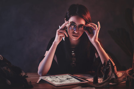 Young attractive girl is working on her new project with puppets.の写真素材