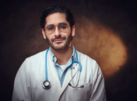 Portrait of handsome bearded medic after a long night shift.の写真素材