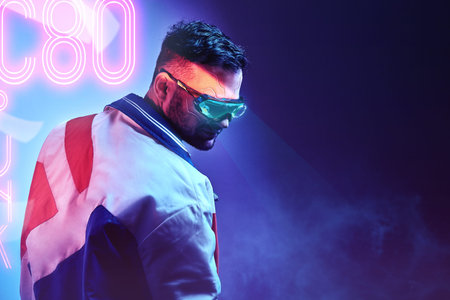Handsome cyborg man wearing modern clothes and futuristic smart vision glasses. Cyberpunk concept...