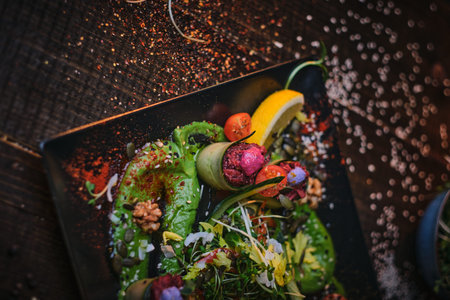 Raw appetizer of grilled and oven baked cucumber rolls served with vegan spread, thin sliced...