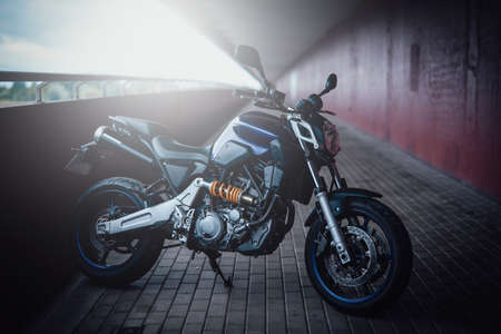 Horizontal shiny view on motorcycle. Stationary custom urban motorbike. Motosport in the city,...