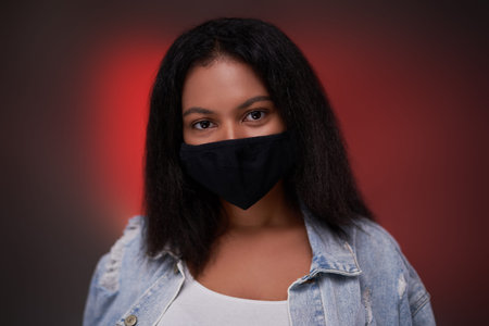 Personal hygiene and protection is important thing today and blackskinned girl which posing shows...